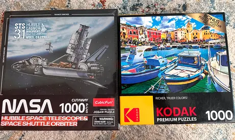 Two 1000-piece Jigsaw Puzzles — NASA Hubble Space Telescope  Kodak Harbor Scene