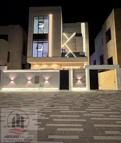 For sale, a villa in Ajman Al Helio, 6 master bedrooms, a majlis, a hall, and a maid’s room, including registration fees, without a down payment