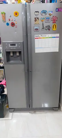 Silver side-by-side refrigerator with water/ice dispenser