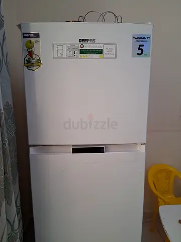 White Two-Door Refrigerator with Freezer — Good Working Condition