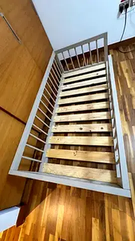 Another Custom made montesorri floor bed with round rails .Made from solid wood.
