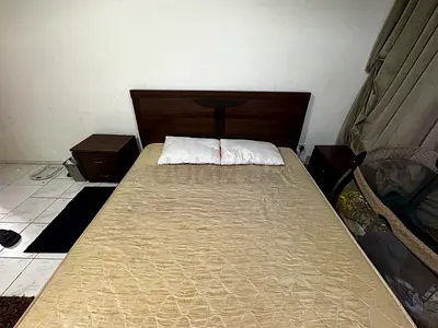 Wooden Double Bed with mattress and Two Nightstands mirror and chair with baby bed Good Condition
