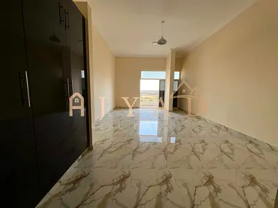 For rent: One-bedroom apartment in Al Muwaihat 3, Ajman, Academy Street. First occupancy. Master bedroom, two bathrooms, balcony, central air