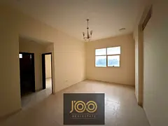 2BR hall in Al Jurf 1, central AC, 2 baths, spacious, near schools &amp; Ammar St, prime spot, ideal