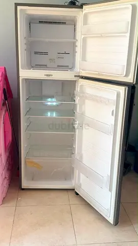 Used two-door refrigerator - working, good condition