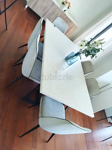 Modern white marble dining table with 6 upholstered chairs