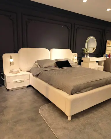 Modern upholstered king bed with attached bedside tables