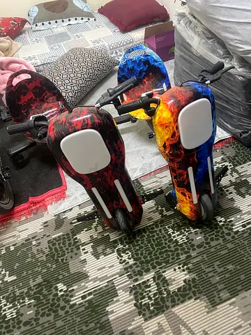 Pair of Kids Ride-On Scooters with Flame Graphics