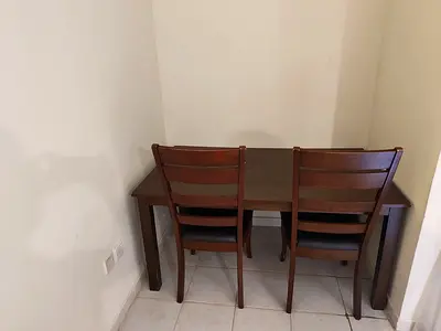 Wooden dining table with two matching chairs - good condition