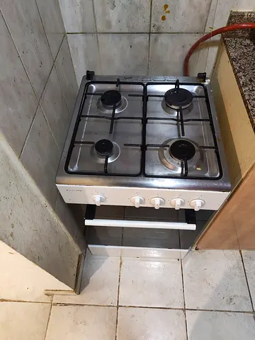 Used 4-Burner Gas Stove with Small Oven - Good Working Condition