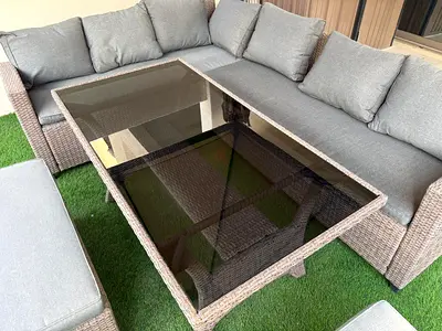 Outdoor rattan corner sofa set with glass-top coffee table