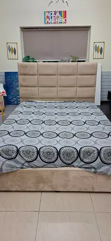 Queen-size upholstered bed with tall padded headboard - beige