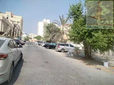 Commercial land for sale in Ajman, Al Nuaimiya 1, in an excellent location, on a corner of two streets,