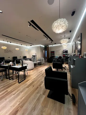 Salon chairs and stations with flooring — full salon setup