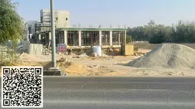 Land for sale in Al Helio 1; a corner plot situated at the intersection of two streets, including a 