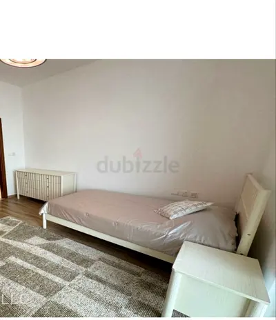 Single white wooden bed frame with mattress and bedside table,dressing and one big rug