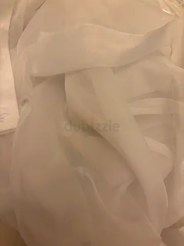 Two pairs of white sheer curtains