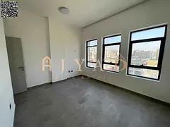 Annual rent: 2BR apartment in Al Alia, Ajman, free month on signing, balcony, built-in wardrobes, ce