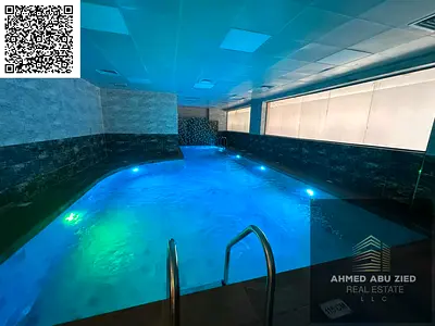 Free gym and swimming pool | Luxurious 2 bedrooms and a hall | Balcony | Majlis | Built-in wardrobes | Central air conditioning | 2 bathrooms | Prime