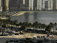 Two bedrooms and a living room in Al Khan, sea view with balcony, free maintenance.