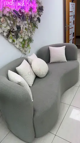 Modern Curved Grey Sofa with Decorative Pillows Originally bought for 1,600 AED, now selling 900 aed