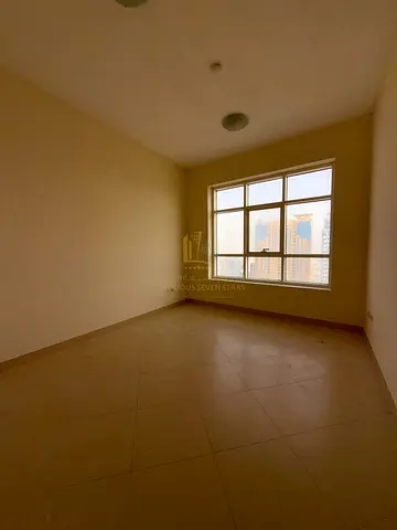 A three-bedroom apartment with a living room for sale, with a rear view