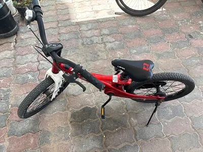 Red kids bicycle - good condition, single speed with kickstand