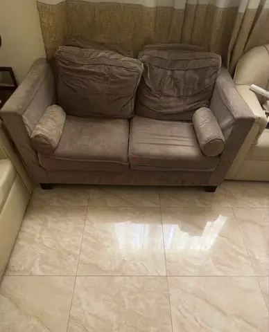 2-seater brown fabric sofa in good used condition
