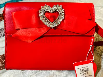 Red womens shoulder bag with bow and crystal heart detail - like new