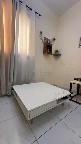Low white wooden coffee table with storage - used