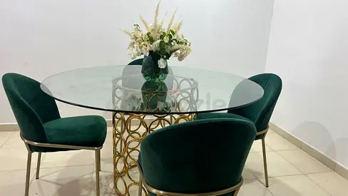 Glass Top Dining Table with Gold Base and 4 Green Velvet Chairs