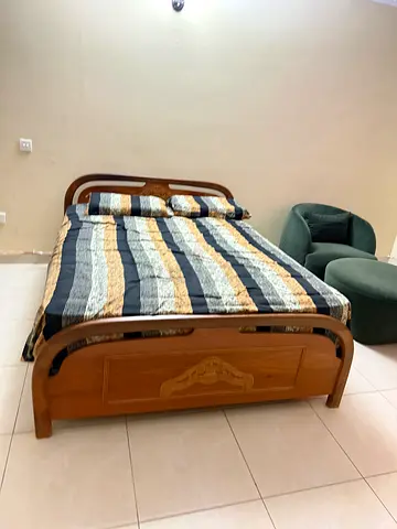 Solid Wood Double Bed with Carved Headboard and Footboard - Good Condition