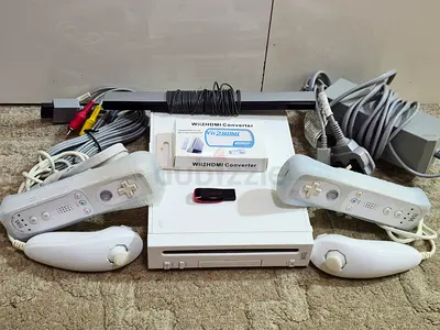 Nintendo Wii with all cables, 2 controllers and more than 50 games