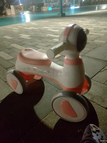 Pink and white toddler ride-on push trike - lightweight and stable