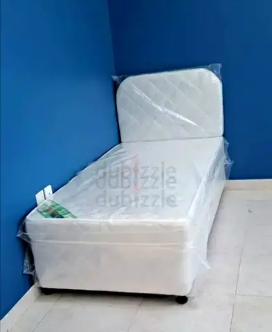 Single bed with mattress and headboard - unused, still wrapped