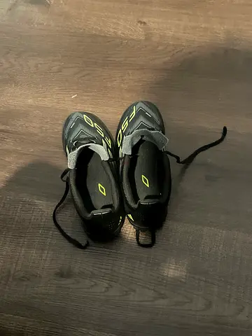 Used pair of kids football/soccer cleats, size unknown — good condition