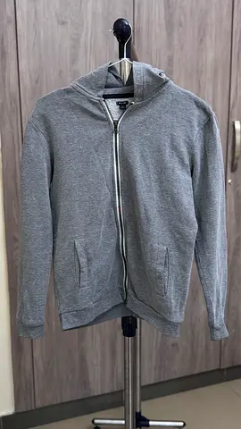 Grey zip-up hoodie, size M — good condition