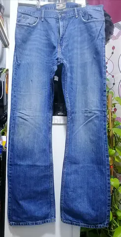 Used mens blue straight-leg jeans, size approx. 36