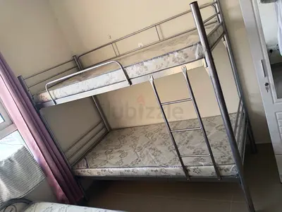 Metal bunk bed frame with two mattresses - good condition