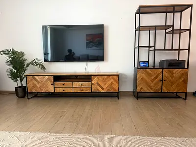 Industrial-style open shelving unit with wooden cabinets