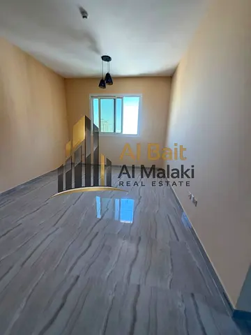 Al Bait Al Malaki Real Estate Annual Apartment for Rent in Al Qasimia – Al Nad A spacious 2-bedroom apartment with a living room, ideal for families,