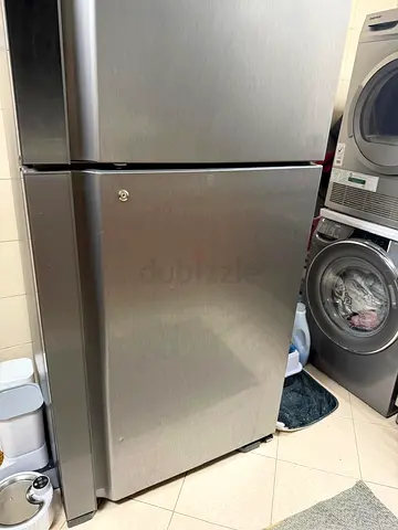Stainless Steel Top Freezer Refrigerator - excellent condition brand new under warranty
