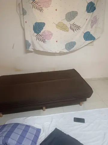 Brown leather-look futon/sofa bed in good used condition