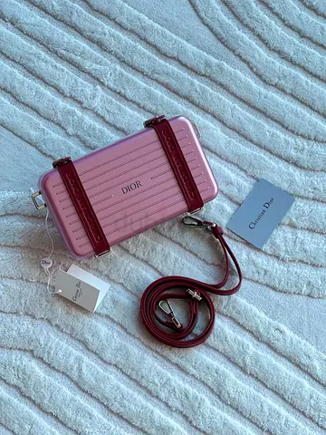 Dior and Rimowa personal clutch