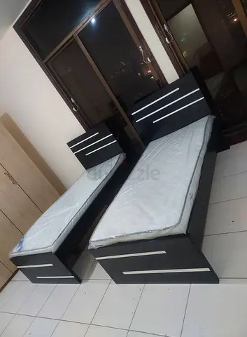 Pair of single beds with mattresses - dark wood finish