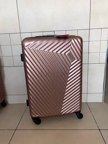 Brand new Rose gold hard-shell spinner suitcase - medium size 24inch. Never used!