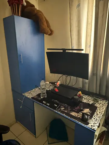 Study table with open shelves and closed shelves.