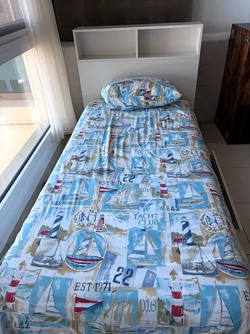 Single bed with mattress and nautical bedding - used a few times. Very good condition