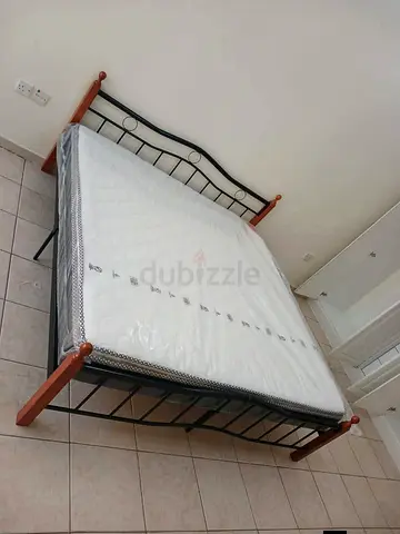 Brand new King size wooden Steel bed frame with Mattress Available