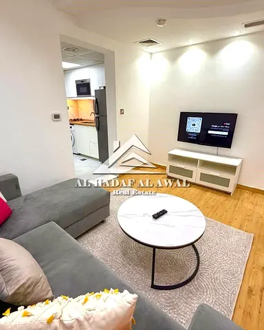 For sale A studio divided into a room and a hall, parquet floors with a direct view of Al Khan Lake, fully equipped kitchen from IKEA. The price inclu